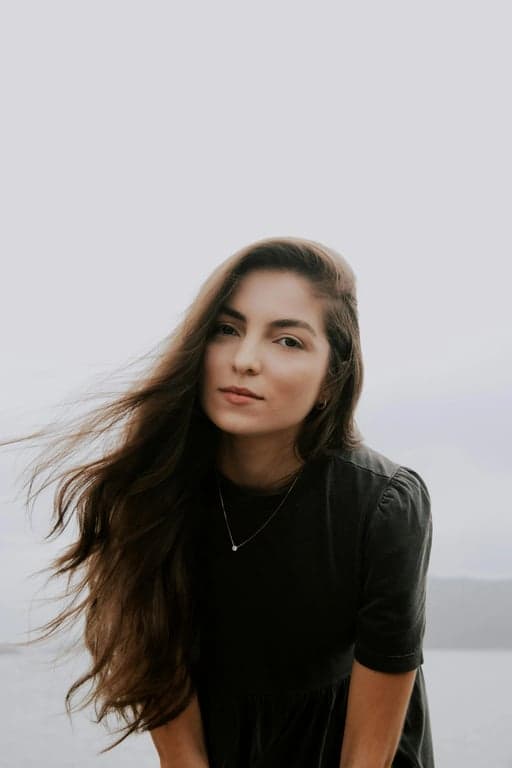 a portrait of a person rendered in an authentic Looney Tunes cartoon art style, featuring highly expressive eyes, oversized mouth shapes, dramatic facial acting, flexible cartoon anatomy, dynamic movement-oriented poses, bold linework, smooth cel animation coloring, and an energetic classic animation feel.